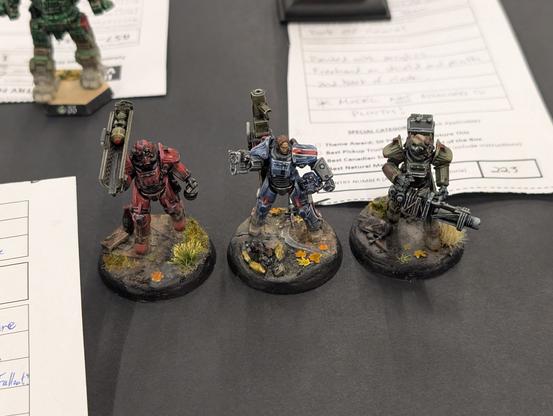 Three Fallout power armour figures