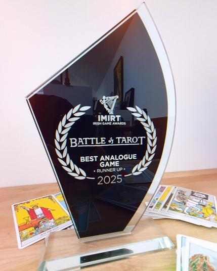 Trophy on a table with Battle of Tarot and Best Analogue Game Runner Up text on it.