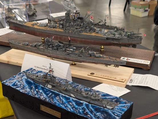 Yamato, a Japanese cruiser, and a German destroyer viewed from the side,