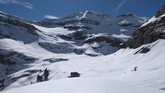 In the background the summit of the "Schneehore" with the its glacier underneath on the left side. Just below us the alpine hut. Several ski tracks going to and coming from the alpine hut.