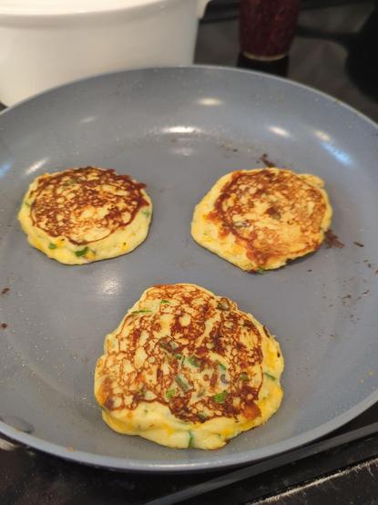 Little latkes frying up on a nonstick skillet