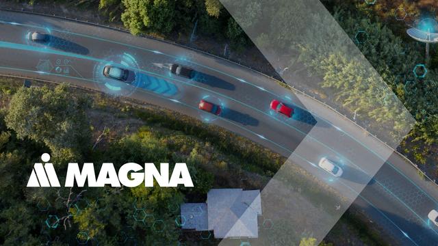 Illustration of a curving road through a forest with autonomous vehicles driving on it, viewed from above, with the white Magna International logo in the bottom left corner.