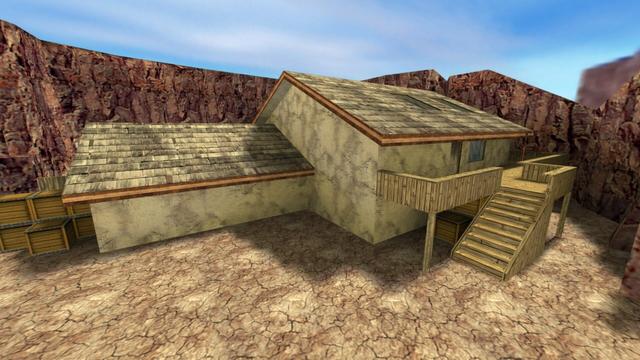 In this picture you can see the other side of the house from the last photo of the previous picture series. To the left of the equipment, which is now on the left side, there are medium-sized wooden boxes. On the right side of the house you can see a wooden balcony / terrace which is located on the first floor. There is also a door and a window to the right. Under the balcony there are more wooden boxes. In addition, the balcony has a staircase that leads downstairs. This is on the map cs_militia in the game Counter-Strike 1.6.