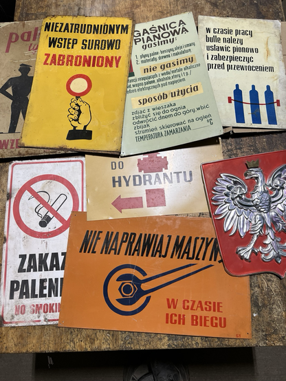 Several warning signs from Poland that are written in Polish.