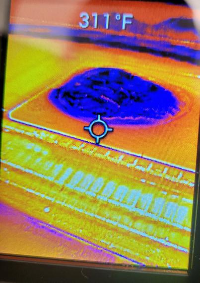Blue pizza ok a hot orange stone reading 311F
