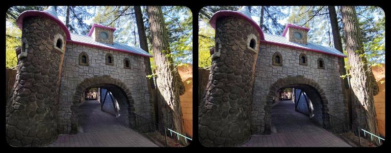 Entrance to Old European Village, Enchanted Forest. Medieval gate, stone tower in left