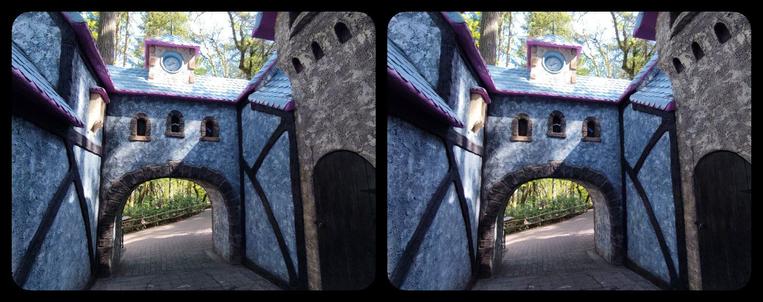 Looking back through entrance to Old European Village, Enchanted Forest. Blue medieval gate.