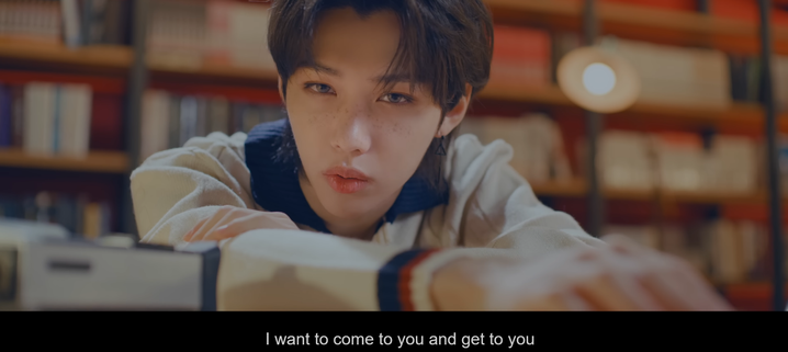 Felix in Mixtape: OH, singing "I want to come to you and get to you" while there's a vintage video camera slightly out of focus on the table in front of him