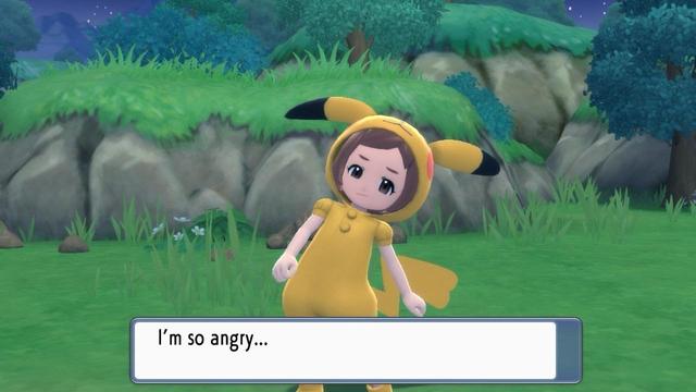 A screenshot from Pokémon Shining Pearl with a Pokéfan wearing a Pikachu onesie looking at the camera saying “I’m so angry…”