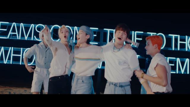 Bang Chan has a determined look on his face as he grabs that Seungmin, with the intention of hoisting him into the air yet again