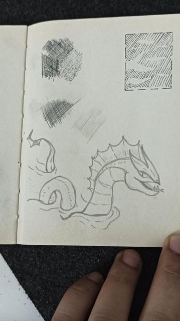 some quick doodle practice, on the left is a sea dragon of sorts, there's some cross hatching practice - and on top right some negative space to create patterns.
