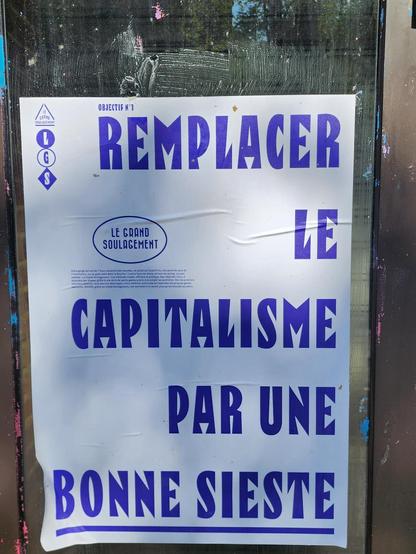 Affiche en capitales violettes sur fond blanc Le Grand Soulagement LGS Caption=OBJECTIF N°1 Remplacer le capitalisme par une bonne sieste