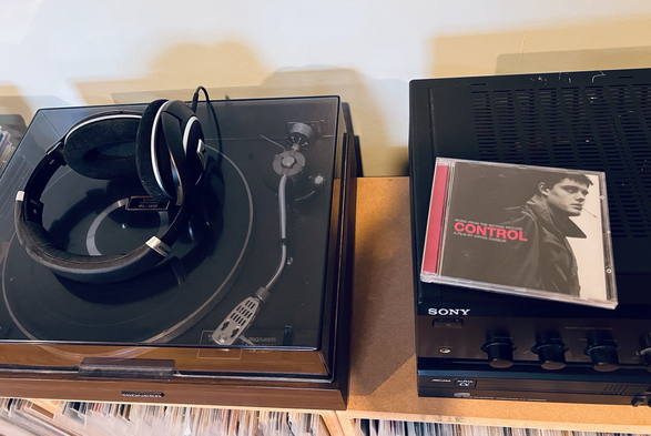 CD case on amplifier, next to record deck