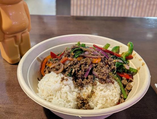 Kraprow bowl from new Thai place in Rodeo 39 with ground beef and Thai Tea in the back corner