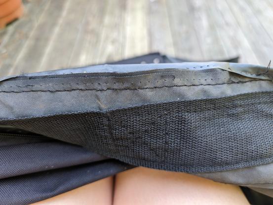 completed seam joining the fabric sides together, with the edge tape still detached