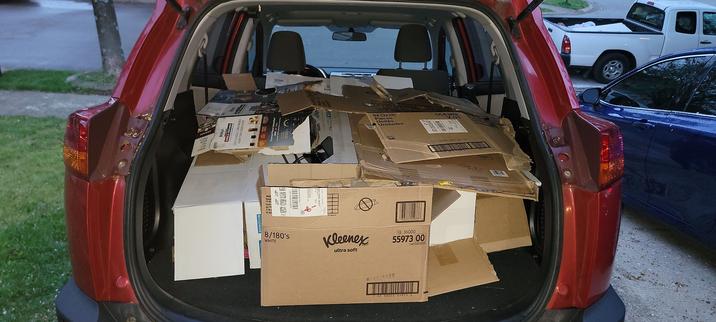 Ruthven the Rav4, viewed from the open rear door, full of broken down cardboard.