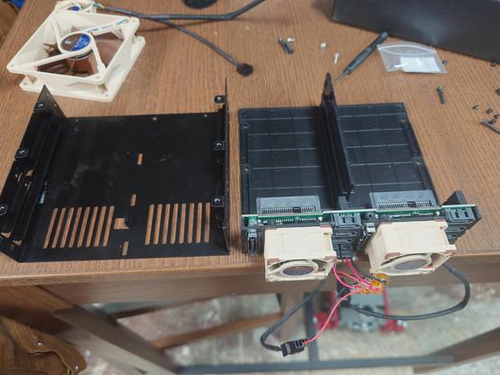 Drive bay opened up. The top was dented and required some straightening with a chisel. Drive bay fans here replaced by noctua 40x20 guys