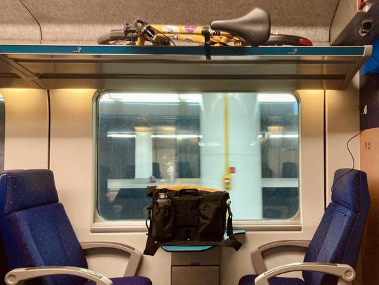 My SUGG bike folded on the luggage rack of a train to Rotterdam
