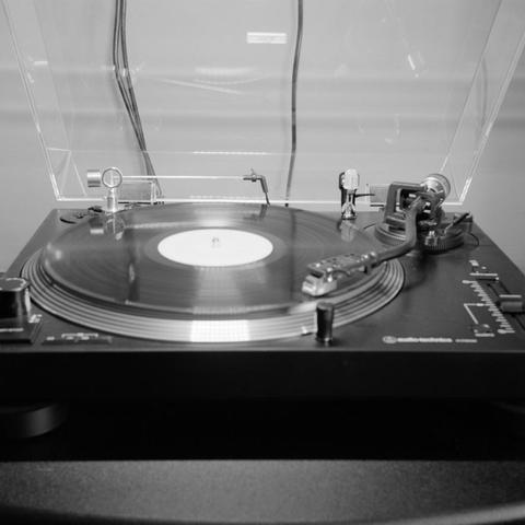 An LP spinning on a turntable