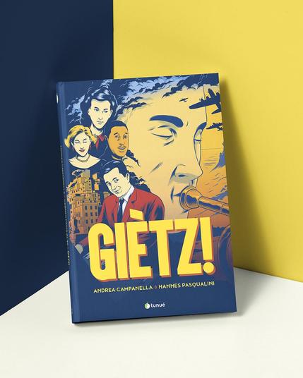 Mockup of the book cover for the graphic nove Giètz!. The cover shows different characters from the comic, arranged in the fashion of a vintage movie poster. The main area of the image is taken up by the main character, with his eyes closed, depicted in the act of blowing his trumpet.
Text: Giètz! - Andrea Campanella, Hannes Pasqualini
Con uno scritto di Paolo Fresu
Postfazione di Elisabetta Umiliani
Tunuè (publisher)