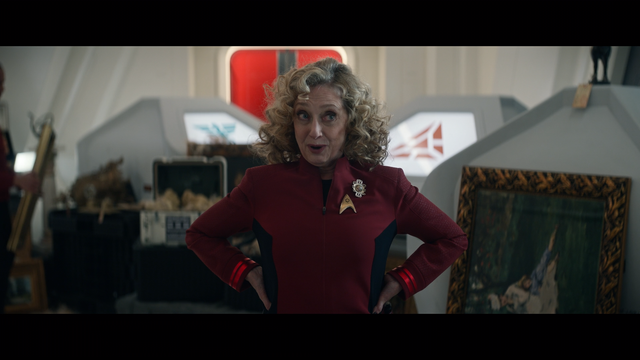 A Star Trek Strange New Worlds shot of Pelia talking with La'an (who is off-camera) on the Enterprise.  From E203
