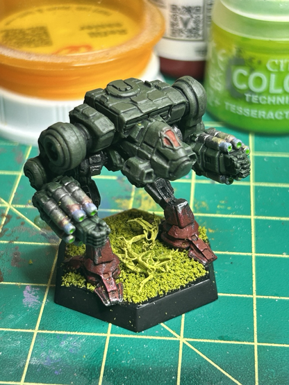 a Nova mech from Clan Jade Falcons, torso painted green, red paint splashed on feet
