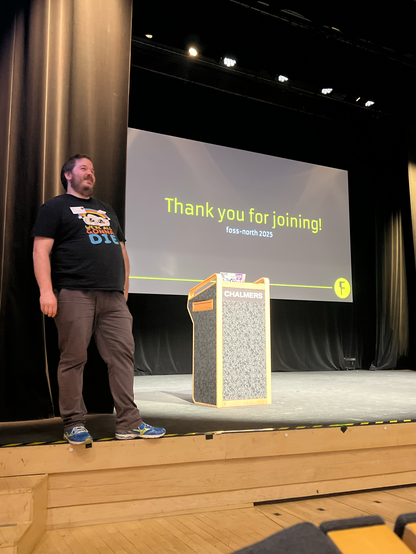 A person standing at a lectern.