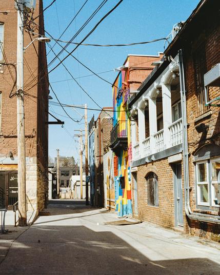 A suburban street in Stillwater, Minnesota, captured on Canon Elan 7e with Fuji 200 film, developed in Cinestill. Warm light softens the scene, but a burst of graffiti and a mess of overhead wires bring a hint of disorder to the otherwise quiet neighborhood