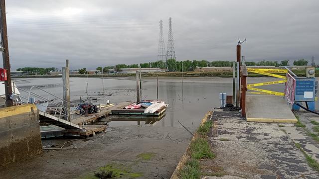 A boat ramp, that I've seen completely covered, with water washing over the parking lot, today leads down to mud. In the middle of what's usually a wide channel, there's a little stream of water