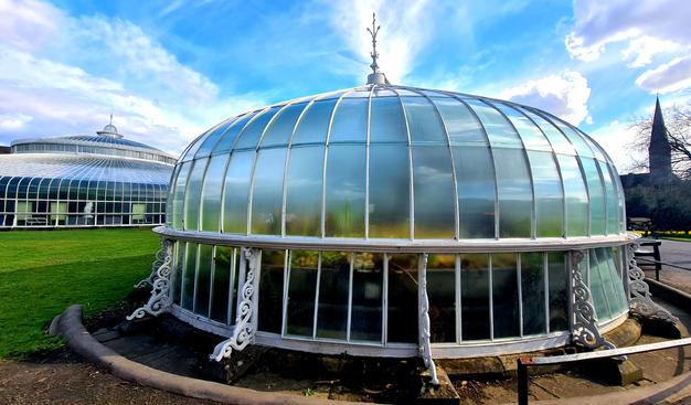 An ornate Victorian era glasshouse in the Glasgow Botanic Gardens.