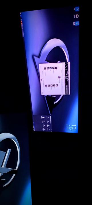 The photograph is of an IPS LED panel showing off the KDE desktop manager in gorgeous Glory with a dark blue background featuring a large, stylized white arrow forming a loop. In the center, there is a white window with black icons and text, including a list of keyboard shortcuts such as "W" for "Windows," "E" for "Explorer," and "R" for "Run." The window is labeled "10x:26:16 Libretto." The screen also displays a taskbar with icons for "FAQ," "Inbox," and "My List," along with a clock showing "10:32" and the date "Thursday, April 11." The bottom left corner of the screen features a small logo with the text "Libretto." The overall design is sleek and modern, with a focus on functionality.

 Ovis2-8B

🌱 Energy used: 0.748 Wh
