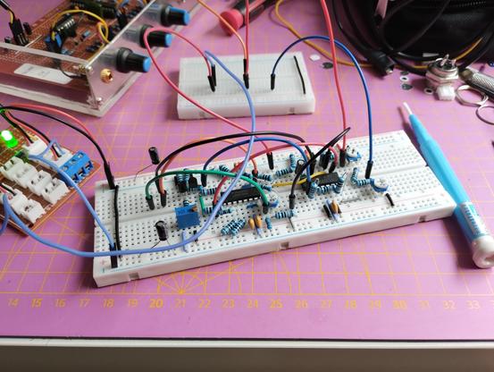 the assembled circuit on a solderless breadboard. the inputs and outputs are connected by long jumper cables