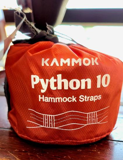 Small red sack with white text on it:

KAMMOK

Python 10

Hammock Straps