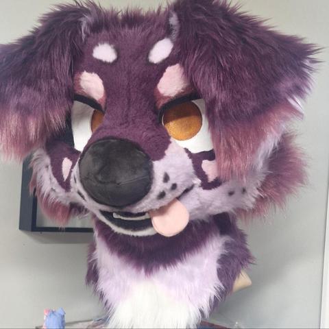 Purple puppy with orange eyes