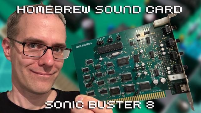 Me holding up a green sound card.