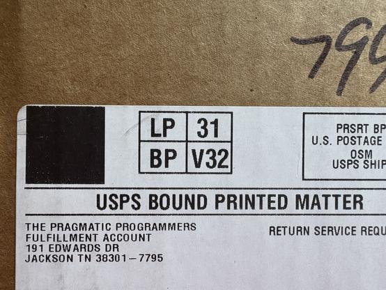 Shipping label on a box, showing that the box contains Bound Printed Matter and was sent by The Pragmatic Programmers.