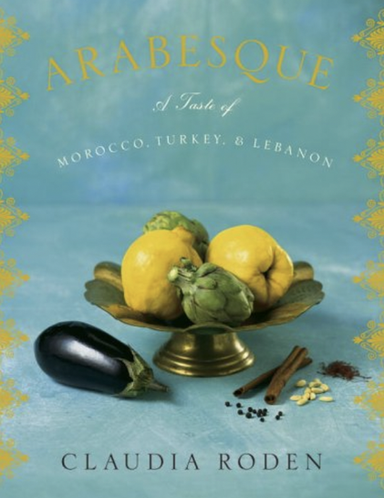 A cover with quinces, artichokes, eggplants and spices. Background is Moroccan-blue with gold patterns around the edge. Text in gold ,white and black.