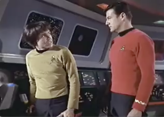 On the bridge of the starship Enterprise, Chekov reports to an unknown lieutenant. This was Chekov's first appearance of the series and his hair looks like a Beatles wig.