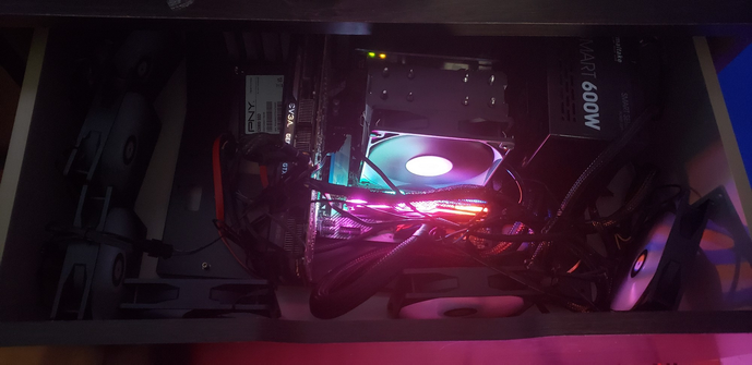 Computer build inside case with fans around it.