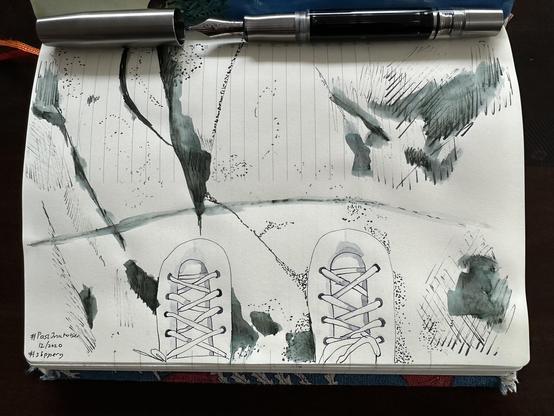 Sketch in sketchbook of a pair of ice skates on the ice.