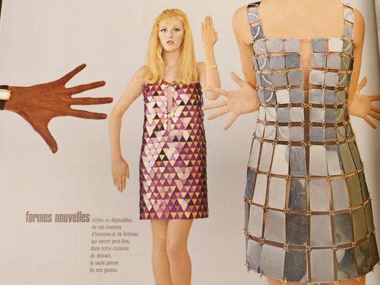 A very 1960s watch ad showing two women in funky dresses.