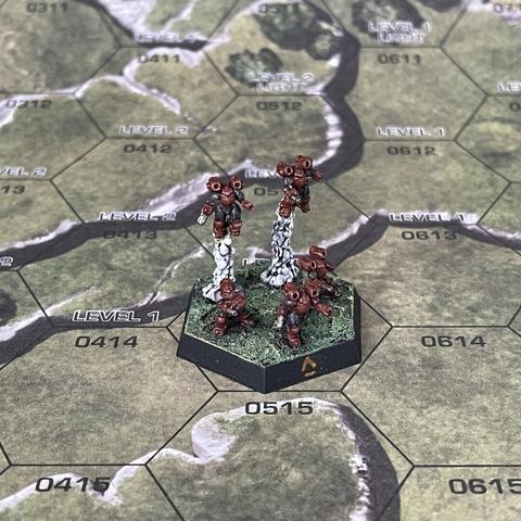 Elemental point miniature painted brown and dark grey