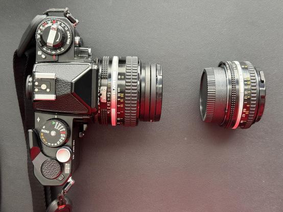 A photo of my camera from above with the normal 50mm f/1.4 lens attached and the pancake sitting next to it.