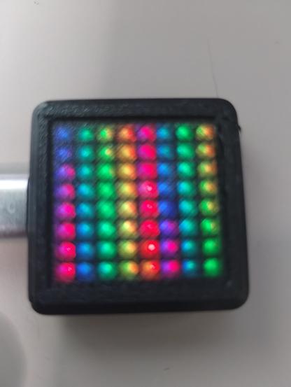 a Waveshare 8x8 ESP32S3 Matrix in a black case with a black defuser....works pretty well under a black defuser - but I really had to bump the brightness of the neopixels up to really see the effects.  This is running the fastLED Demo100 program