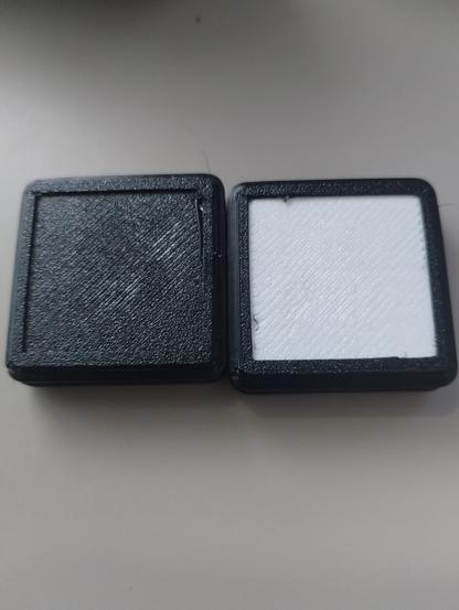 2 Waveshare 8x8 Matrix boards within 3d printed black cases, one with a black defuser and one with a white defuser. Not on, or displaying anything.  
The white defuser (personally) I think works better then the black, and I can lower the brightness of the leds and it still looks very bright.
