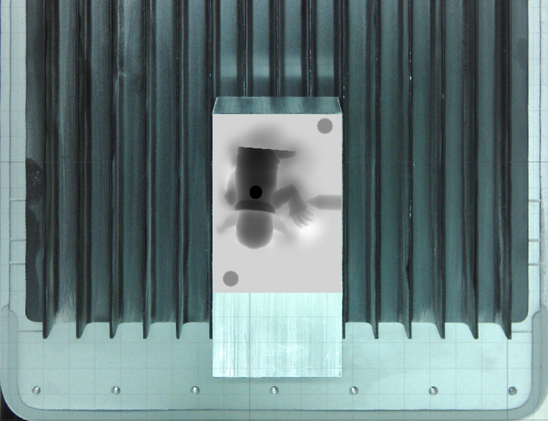 A photo taken through our fiber laser's built-in top-down camera showing the work area, the bar of aluminum, and the depth map of an upside down back of Nosferatu along with a couple keying holes and the fill sprue off to the right side.