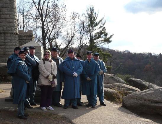 A group of reenactors (and me) dressed in our winter wear over Remembrance Day atop Little Round Top at Gettysburg.
