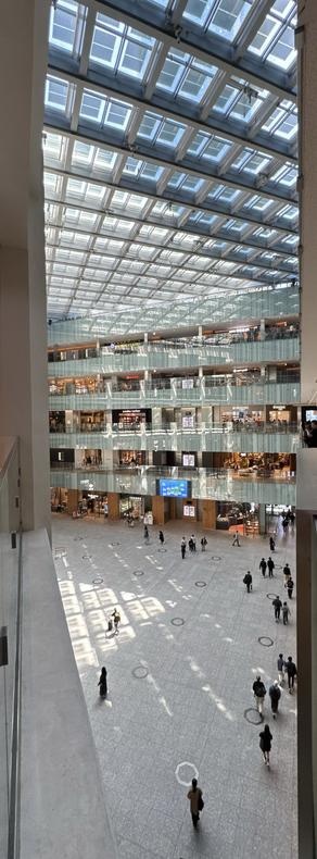 Vertical panoramic photo taken inside JP Tower / KITTE Building in Tokyo, Japan.