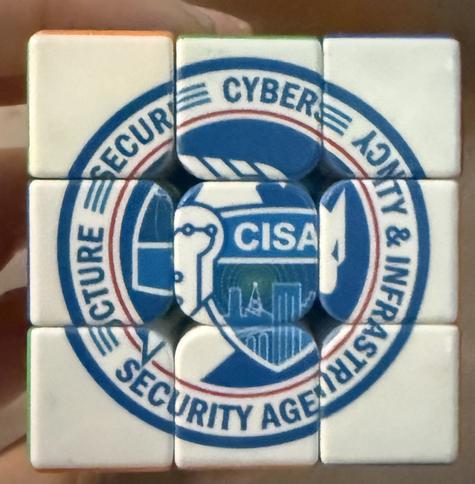 Scrambled up CISA logo on a rubix cube