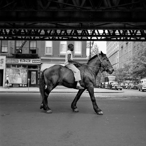 Photo made by Vivain Maier in the 1950 ' s in New York.
In her free hours as nanny 
Picture is a boy riding on a horse in a street